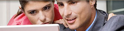 Image of two people at the computer